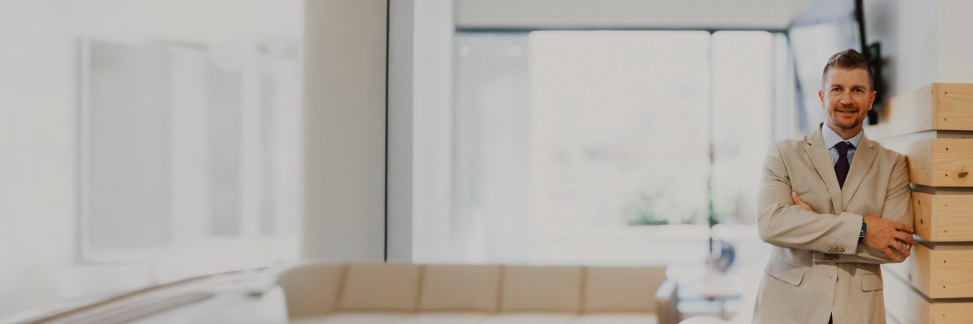 man leaning against a wall in an office
