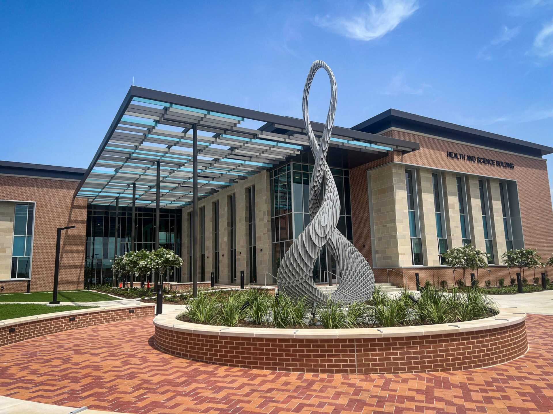 front of building with sculpture