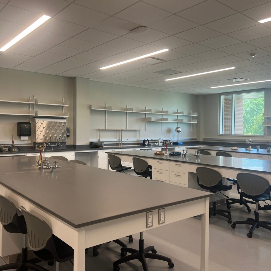a classroom with tables and chairs