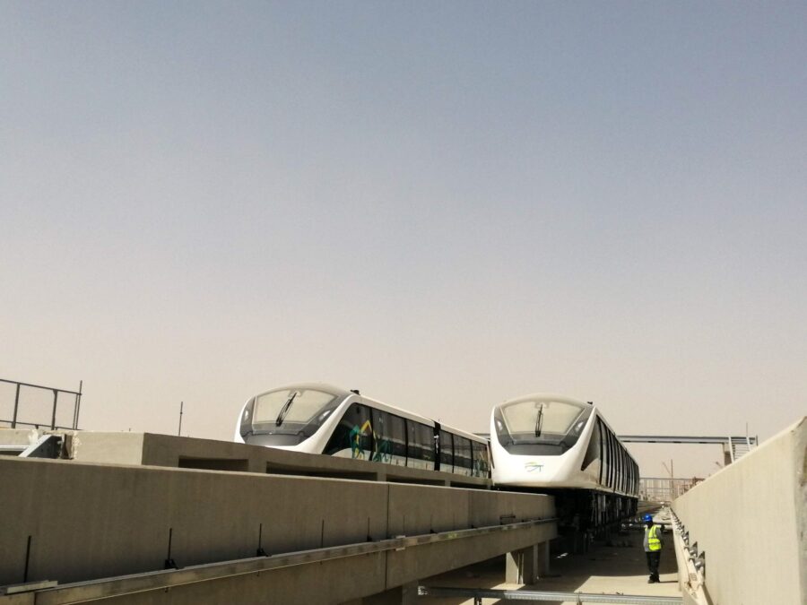 Two monorail trains stopped on Parelle tracks.