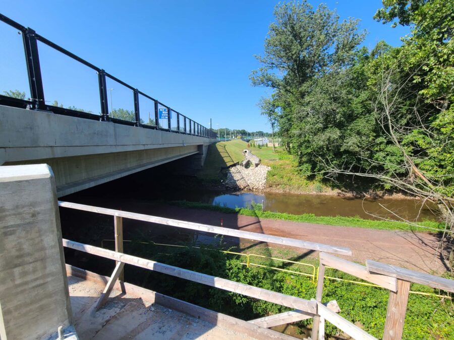 A river canal with a bridge spanning over the river.