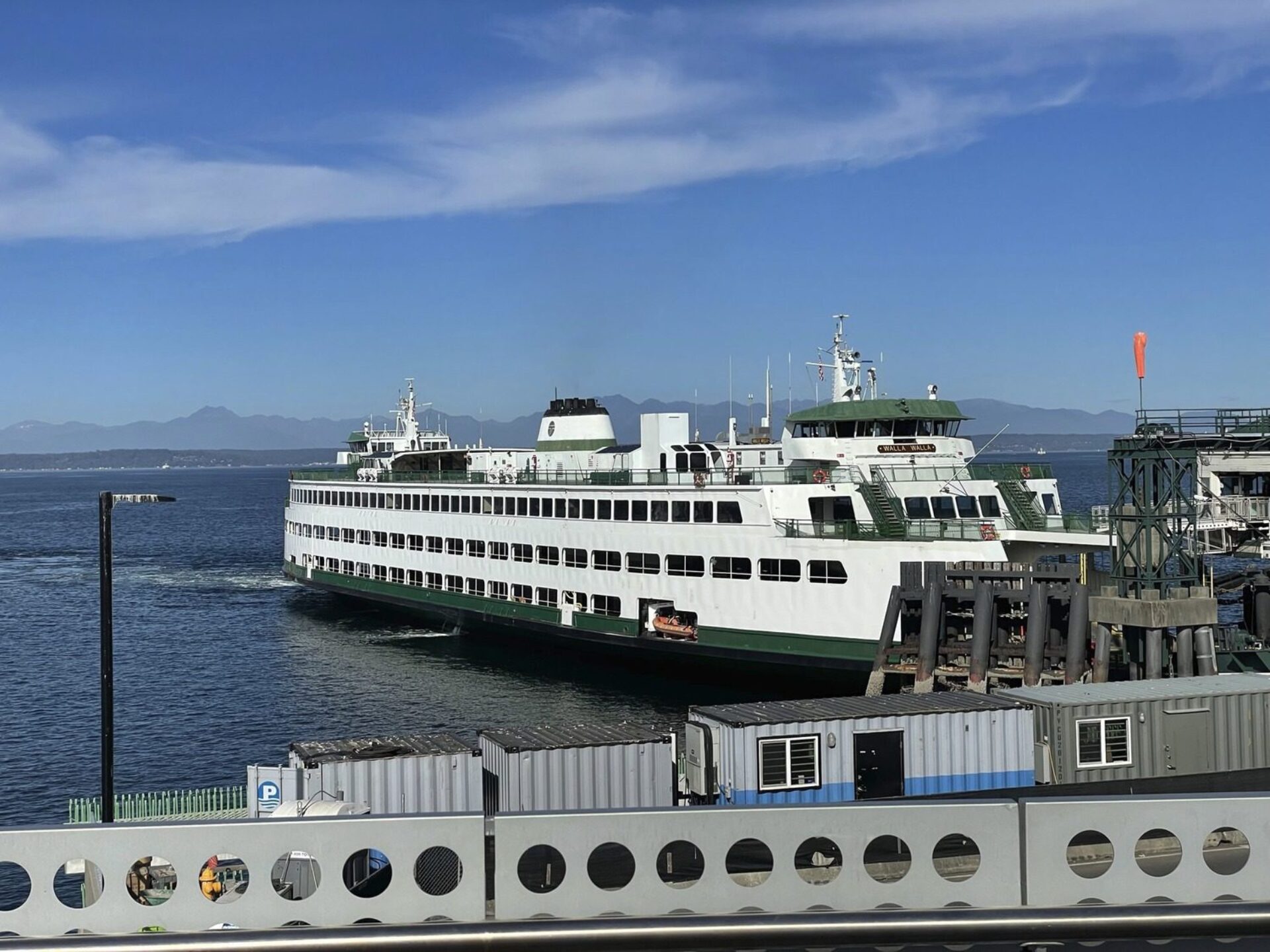 A Large ferry docked at a port.