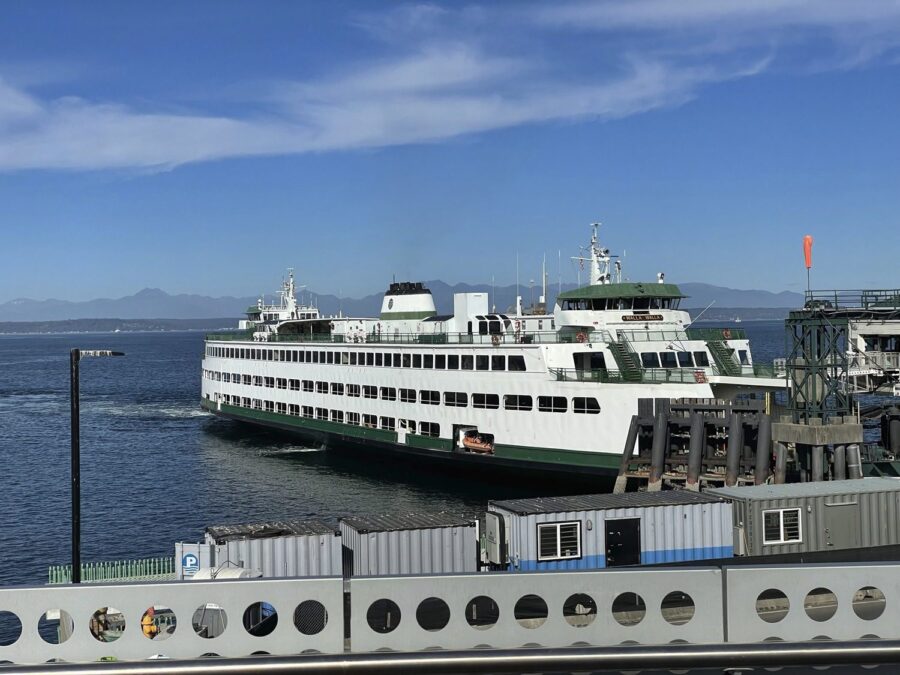 A Large ferry docked at a port.