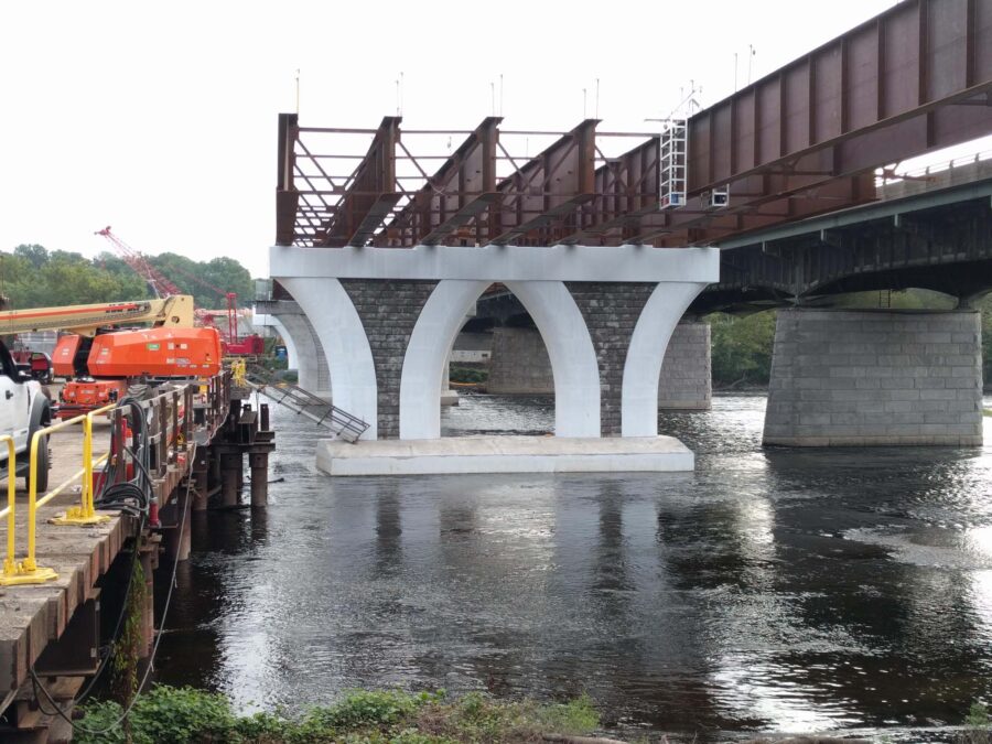 The cross section of a partially built bridge.