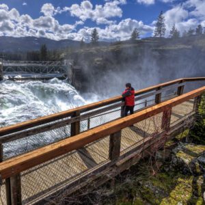 Woman,On,Walkway,At,The,Post,Falls,Dam,In,Idaho.