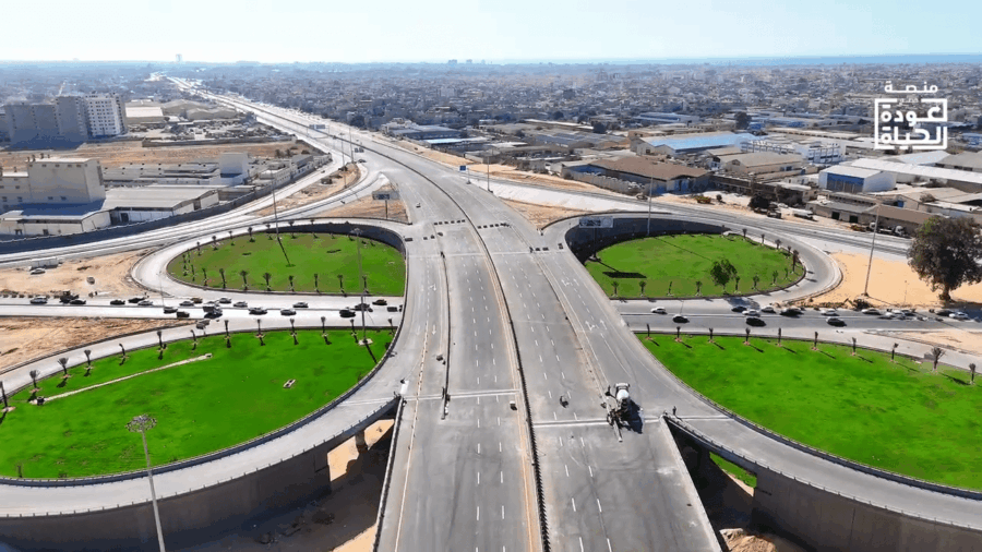 A large freeway intersection in the middle of a city.